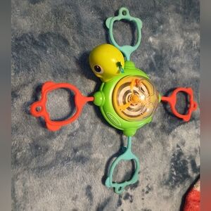 Infantino Green and Red Turtle Spinner Toy